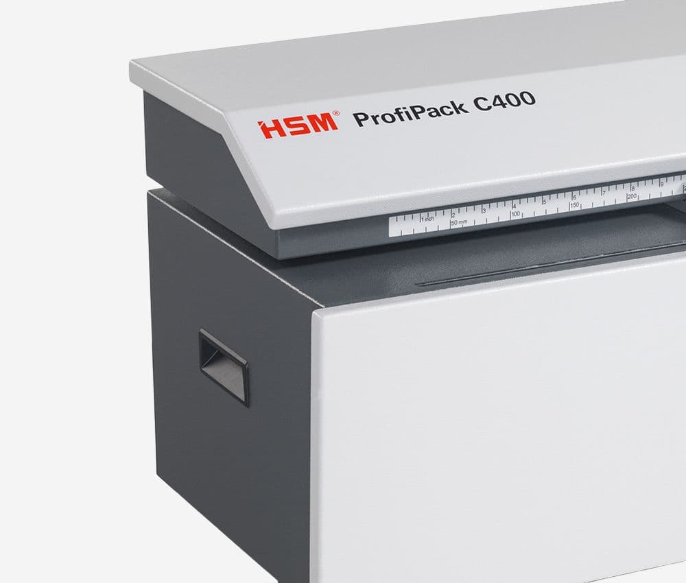 Le Matelasseur de cartons pour calage ProfiPack C400 HSM est équipé de poignées encastrées latérales pour faciliter sa manipulation.